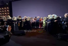 أعضاء أوركسترا النور والأمل يلتقطون صورًا مع سميح ساويرس في مهرجان الجونة السينمائي